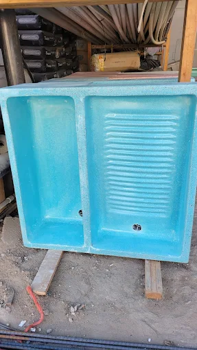 Lavadero de fibra de vidrio color turquesa